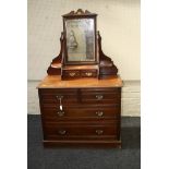A late Victorian walnut Heals & Sons mirror back dressing table, fitted two short over three long