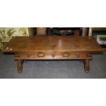 An 18th century-style Spanish low table with turned supports and frieze drawers