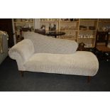 A contemporary Sofa Workshop chaise longue/day bed, upholstered in cut pile black and white check,