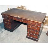 A Victorian walnut pedestal desk, with inverted break front, fitted banks of drawers below a