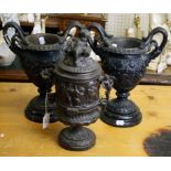 A 19th century pair of classical style spelter two handled urns, together with a cherub mounted urn,