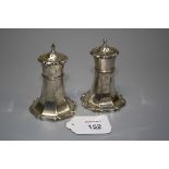 James Deakin, a pair of silver peppers of tower form with re-entrant base, Sheffield 1910, 9cm