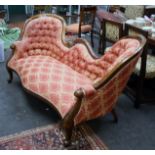 A Victorian-style show wood frame camel back salon settee, with pomegranate and acanthus carved