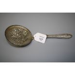 A Russian silver sifter spoon, the generous pierced dished bowl stamped 84, with a trellis