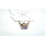 A 9ct gold, amethyst and diamond ring in a heart s