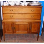The matching Edwardian chest of drawers with cupbo
