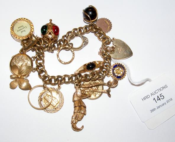 A lady's 9ct gold charm bracelet - 67g