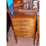 An early 20th century Art Nouveau music cabinet wi