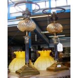 A pair of 36cm high oil lamps of column form
