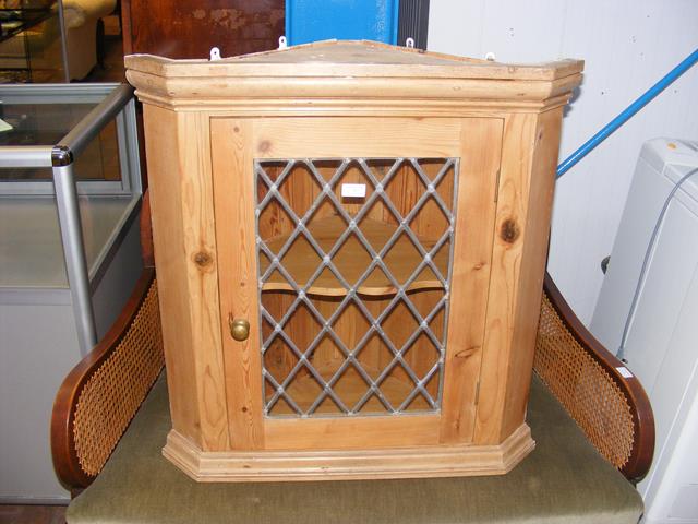 A leaded pine corner cupboard