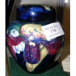 A Moorcroft pottery jar and cover of orchid design