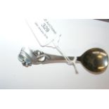 Danish silver caddy spoon with stylized leaf and b