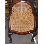 Antique cane work tub chair with cabriole front su