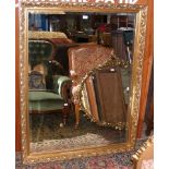 Decorative bevelled wall mirror in gilt surround -