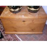 An antique pine blanket chest