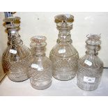 A pair of Georgian cut glass decanters - 24cm high