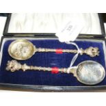 Cased near pair of silver-gilt Coronation spoons -