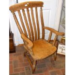 A 19th century elm and beech lath back armchair -