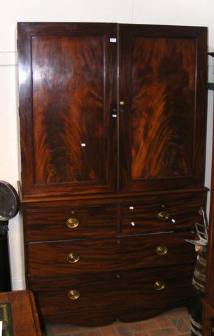 A 19th century mahogany linen press (lacking corni