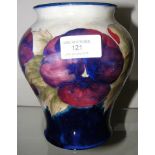 A Moorcroft pottery baluster vase with pansy decor