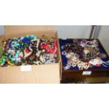 A box of costume jewellery, together with one othe