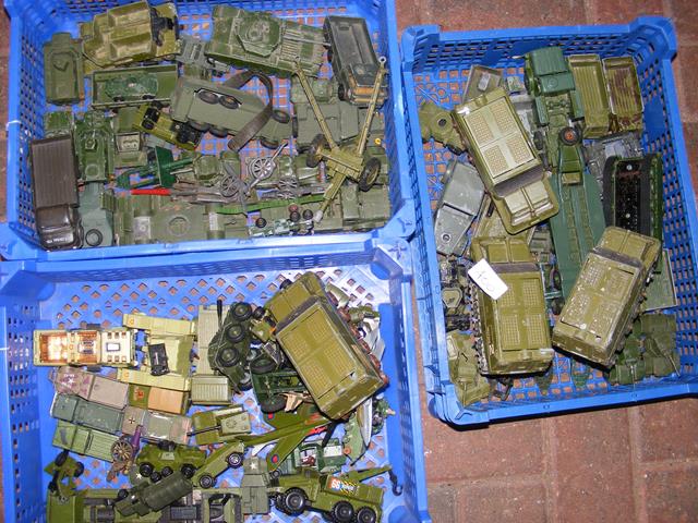 Three plastic trays containing die-cast Army vehic