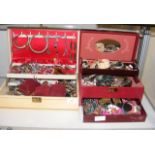 A jewellery box containing costume jewellery, broo