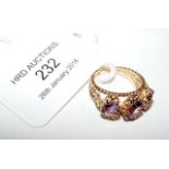 A 9ct gold three stone amethyst ring