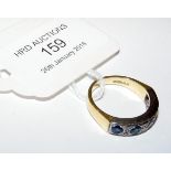 A lady's sapphire and diamond ring in 18ct gold se