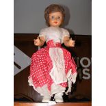 A 20th century doll with sleepy blue eyes - height