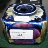 A Moorcroft pottery inkwell of square form with fl