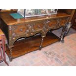 An oak dresser base with two drawers to the front