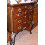 An antique mahogany chest on cabriole supports wit