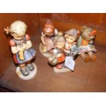 Four Hummel figures