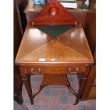 An Edwardian envelope card table with drawer to th