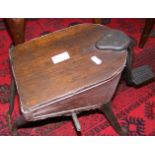 An antique oak and wrought iron foot bellow