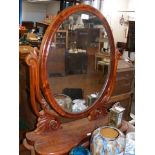 A Victorian mahogany toilet mirror with compartmen