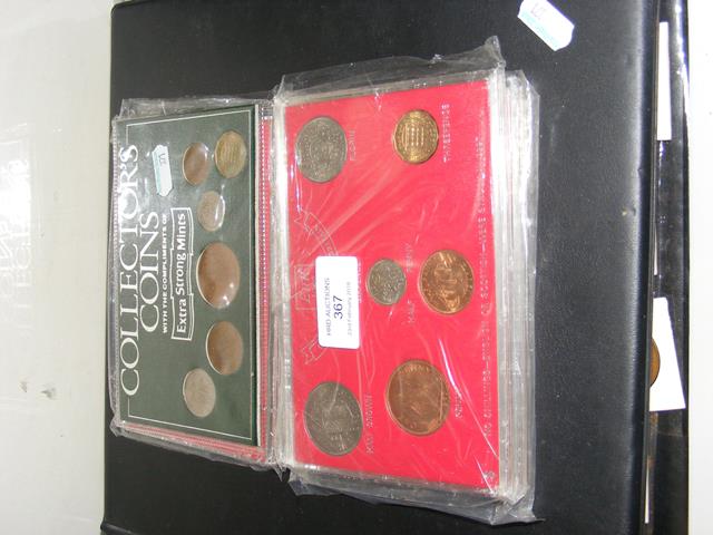 Collectable coin sets, together with a folder