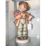 An extremely large Hummel figure of boy playing vi