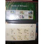An album containing GB mint sets and miniature she