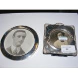 Circular silver photo frame, together with one oth
