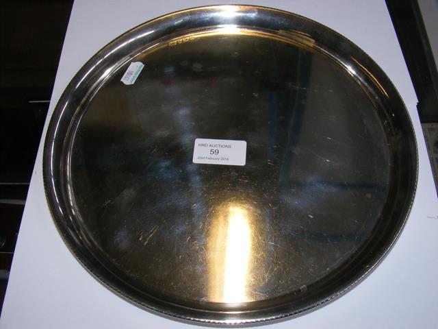 A 27cm diameter silver salver with Birmingham hall
