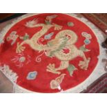 A 160cm diameter Chinese rug with red dragon desig
