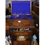 An oak canteen of cutlery on stand (selection of c