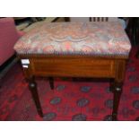 An Edwardian piano stool with hinged seat