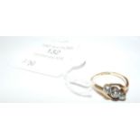 A lady's attractive three stone diamond ring in 18