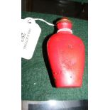 A red lacquer snuff bottle with spoon