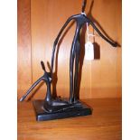 Unusual bronze of stick man and woman