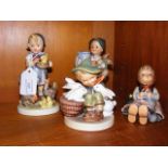 Four Hummel figures