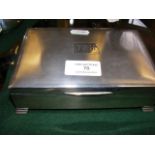A 16cm silver cigarette box with engine turned dec